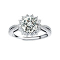 Close-up of sterling silver halo ring with brilliant round moissanite center stone surrounded by smaller accent stones