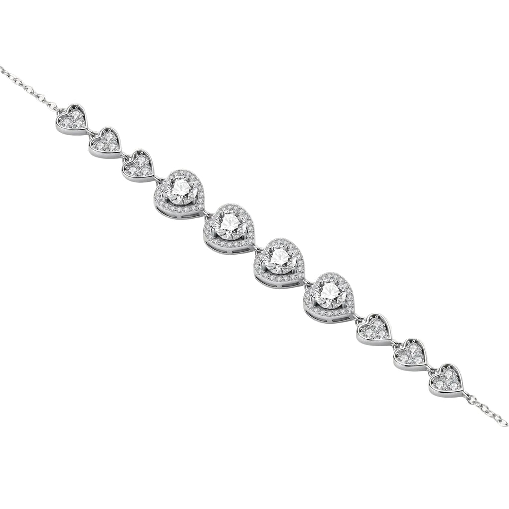 Complete jewelry set with heart-shaped sterling silver pieces featuring brilliant moissanite stones on white background.