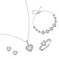 Complete jewelry set with heart-shaped sterling silver pieces featuring brilliant moissanite stones on white background.
