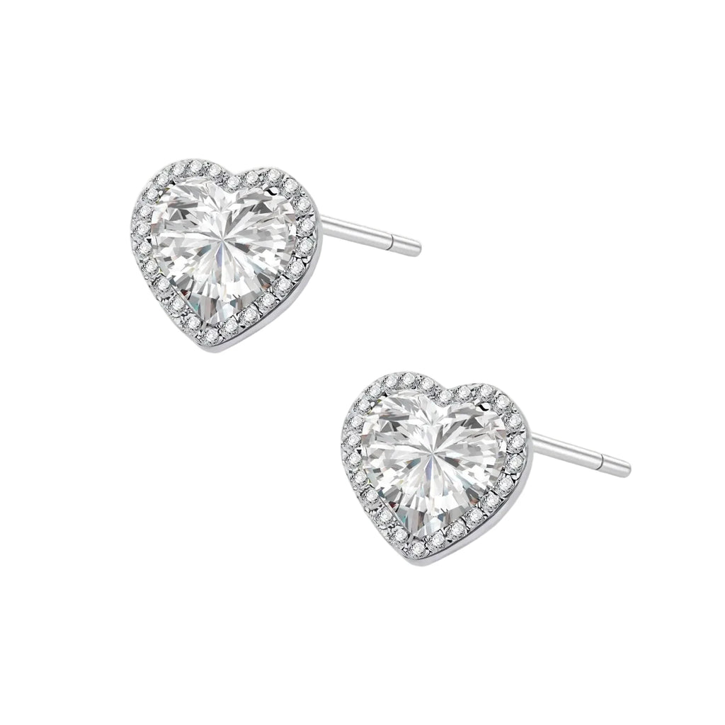 Complete jewelry set with heart-shaped sterling silver pieces featuring brilliant moissanite stones on white background.