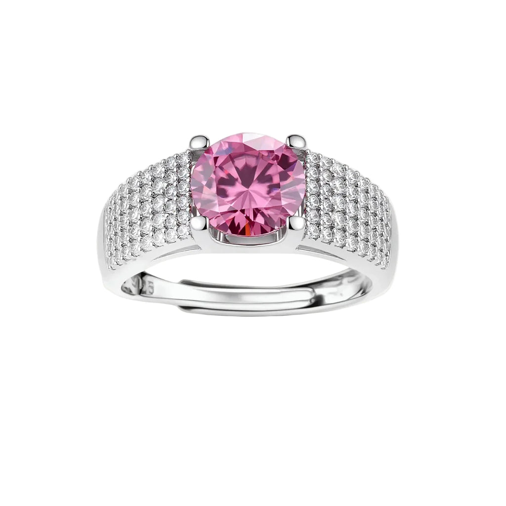Sterling silver jewelry set featuring pink moissanite stones in halo settings on white background.