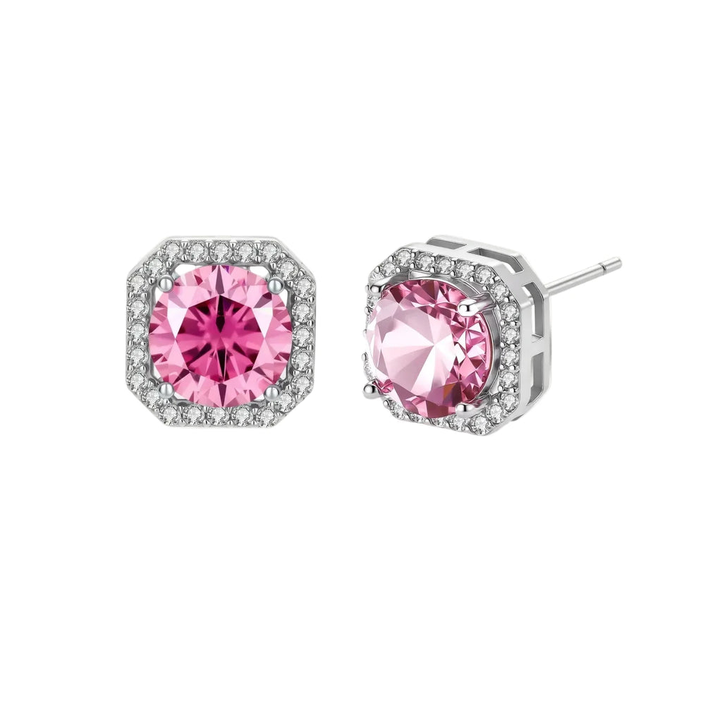 Sterling silver jewelry set featuring pink moissanite stones in halo settings on white background.