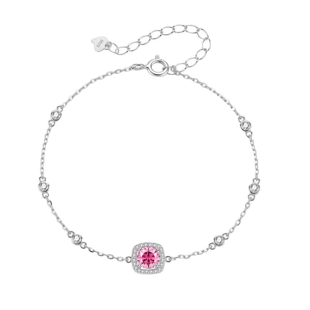 Sterling silver jewelry set featuring pink moissanite stones in halo settings on white background.