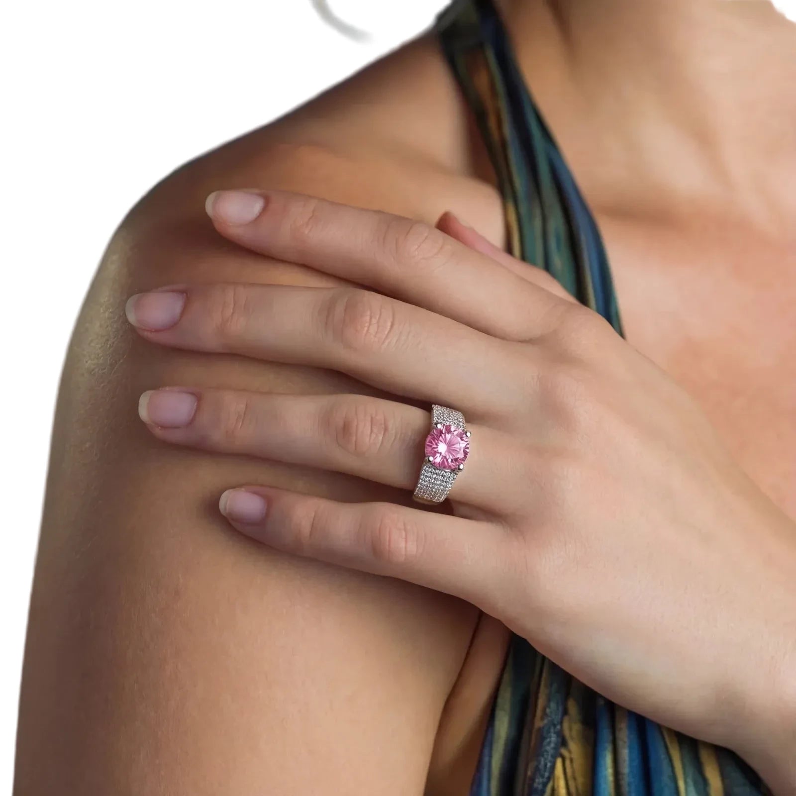 Sterling silver jewelry set featuring pink moissanite stones in halo settings on white background.