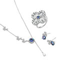 Sterling silver jewelry set with rainbow moissanite stones in clover and butterfly designs on cream background