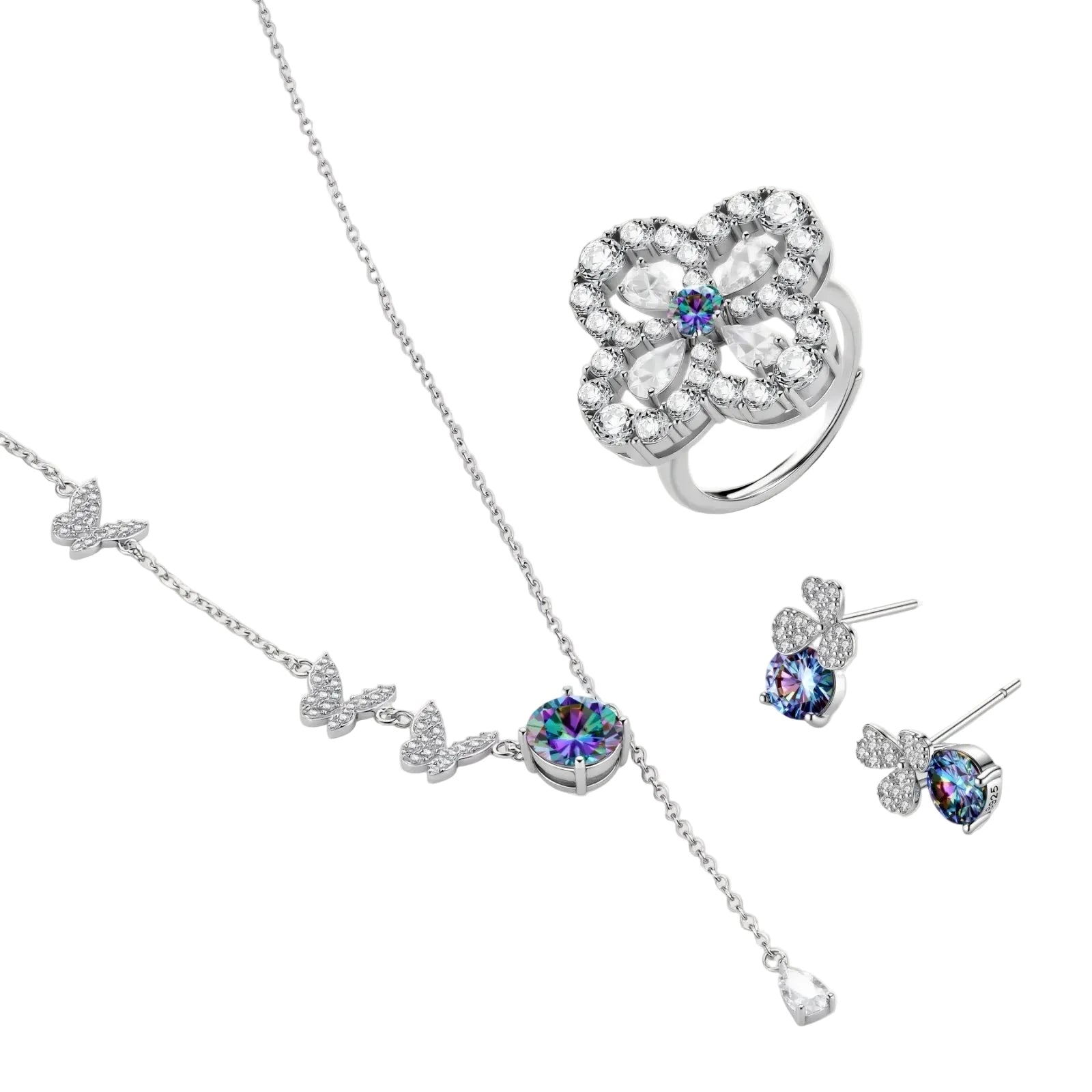 Sterling silver jewelry set with rainbow moissanite stones in clover and butterfly designs on cream background