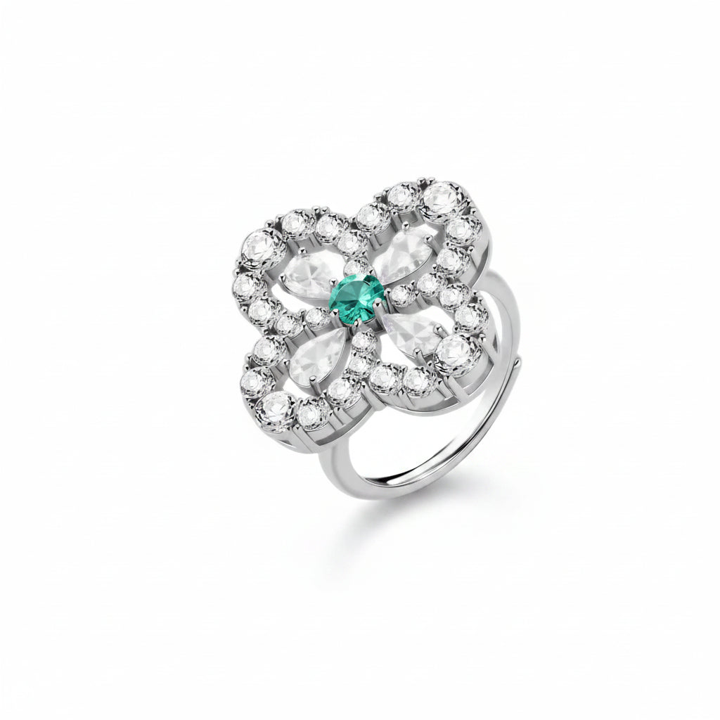 Sterling silver adjustable ring featuring four-leaf clover design with green center moissanite and clear accent stones