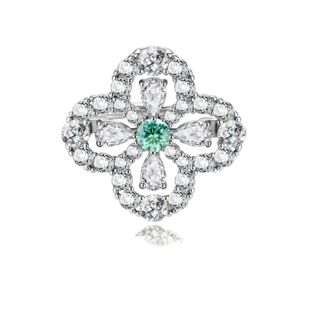 Sterling silver adjustable ring featuring four-leaf clover design with green center moissanite and clear accent stones