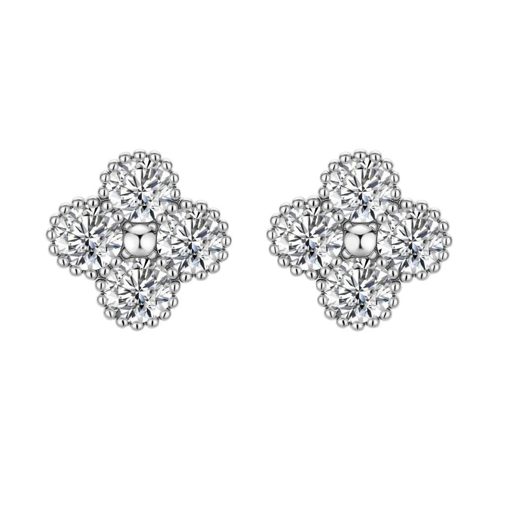 Dainty sterling silver quatrefoil stud earrings with four brilliant moissanite stones and center accent on white background.