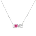 Sterling silver LOVE necklace with pink moissanite stone replacing the O, featuring crystal-set letters on delicate chain.