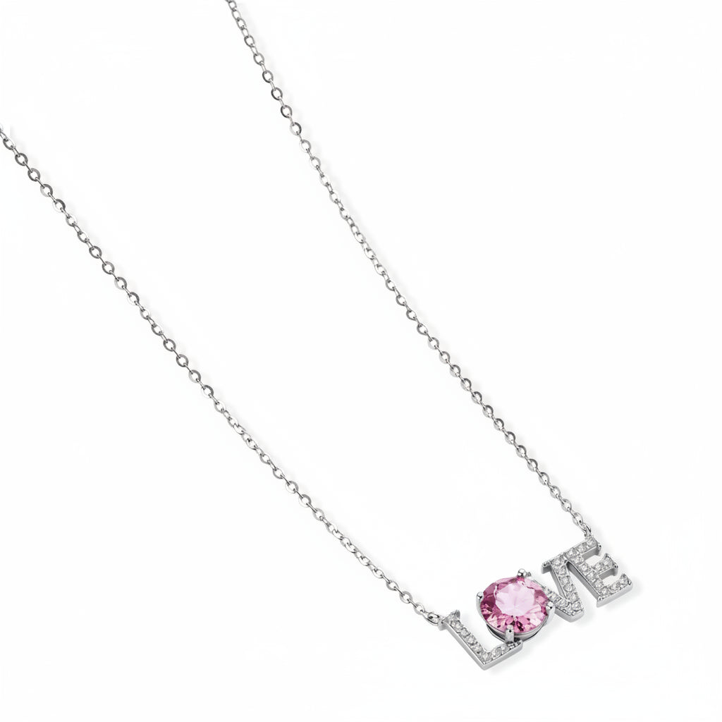 Sterling silver LOVE necklace with pink moissanite stone replacing the O, featuring crystal-set letters on delicate chain.