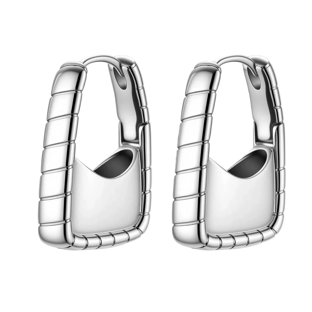 Close-up of platinum-plated sterling silver hoop earrings with horizontal textured grooves on white background.