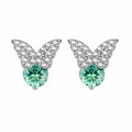 Sterling silver butterfly stud earrings with crystal wings and mint green center stones on cream background.