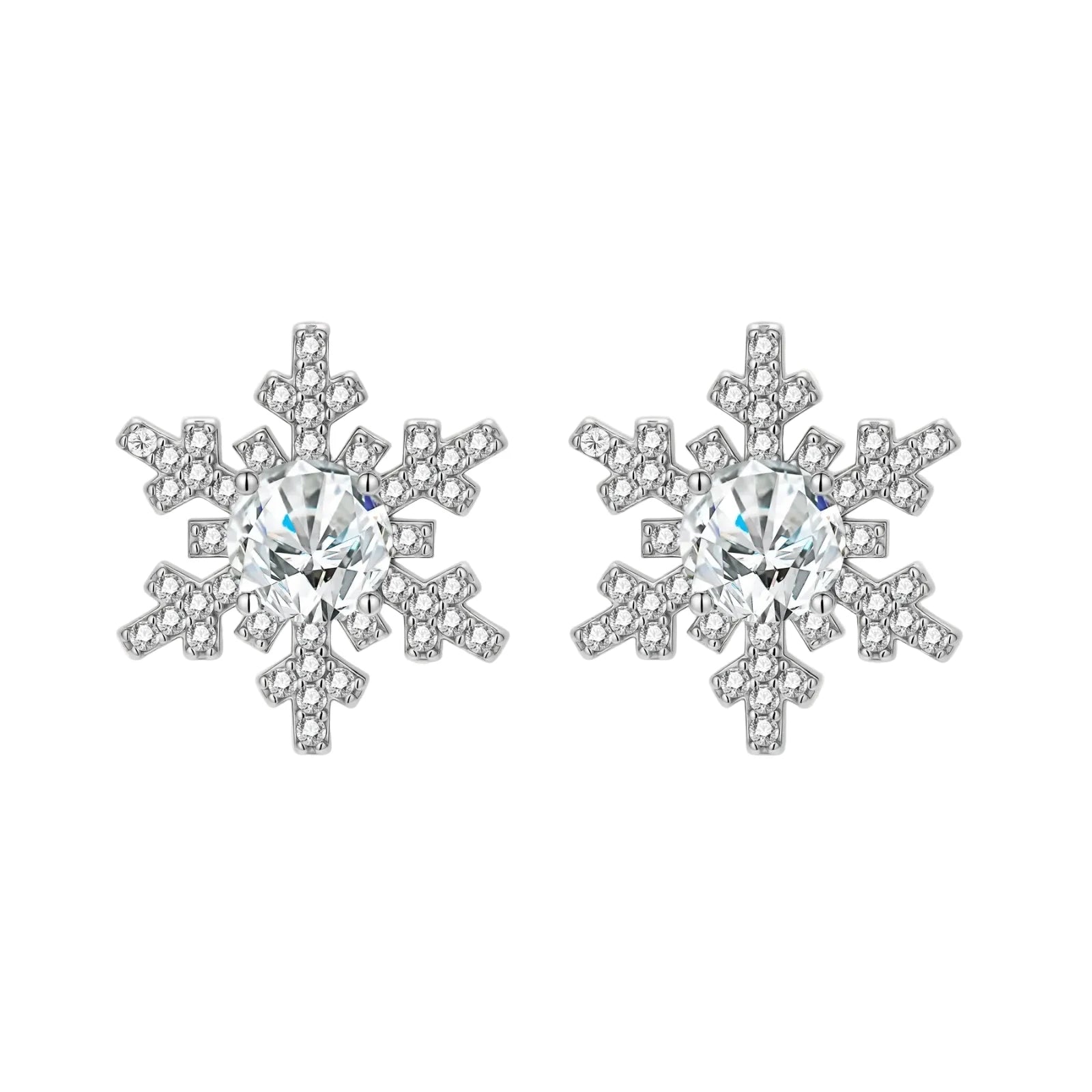 Sterling silver snowflake stud earrings with brilliant moissanite centers and intricate geometric patterns on cream background
