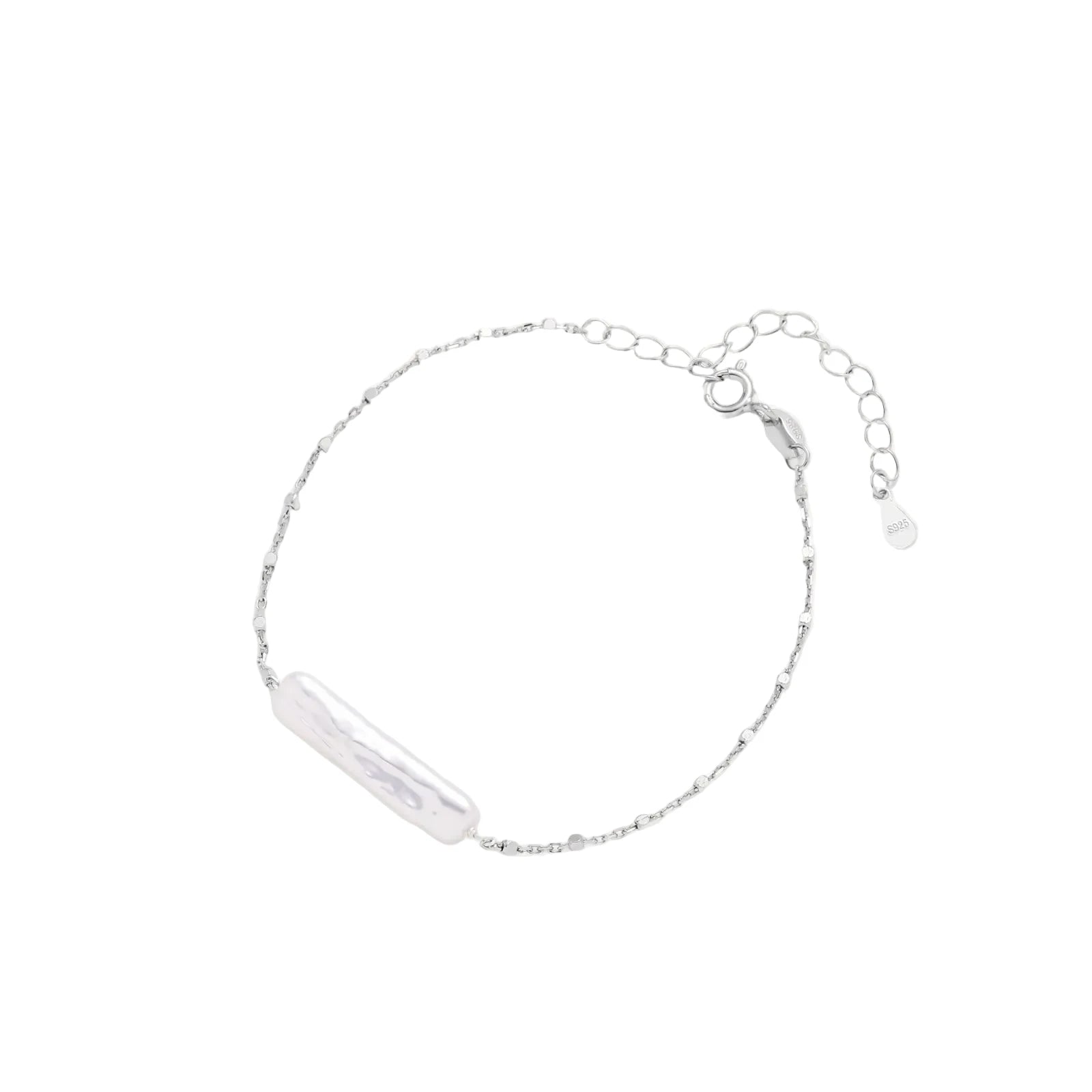 Minimalist bracelet with iridescent baroque pearl on rhodium-plated sterling silver chain against cream background