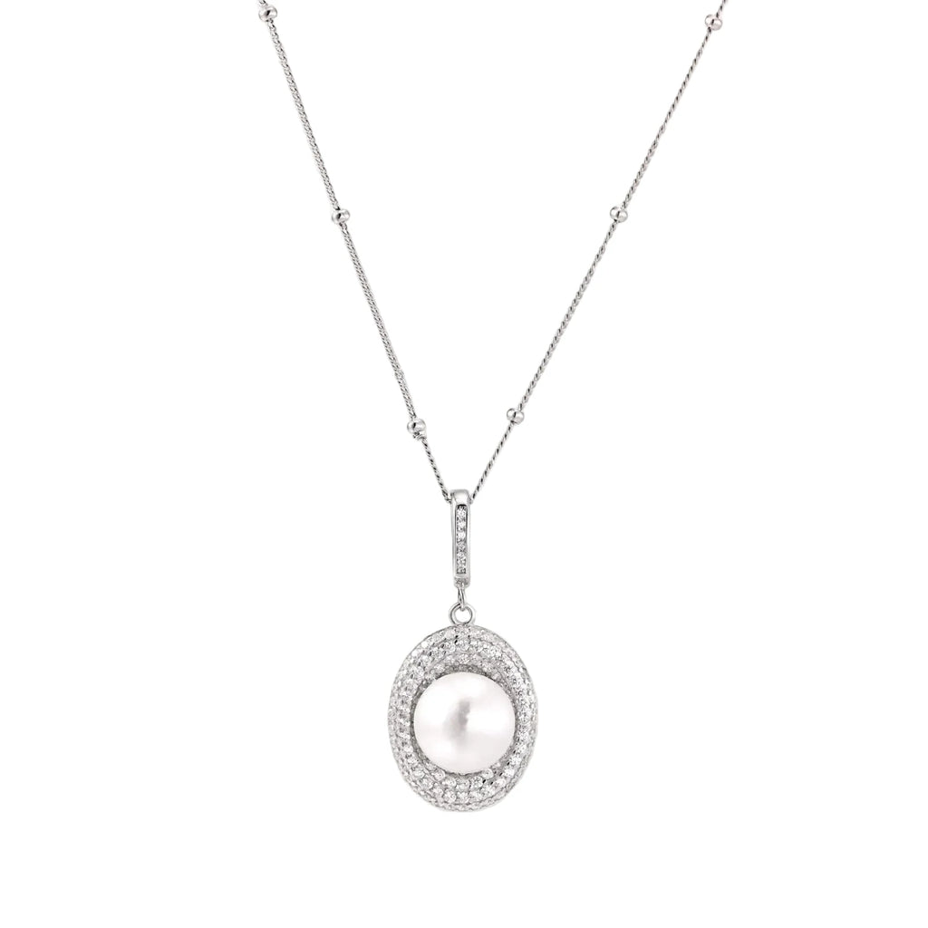 Oval sterling silver pendant with crystal halo surrounding a white freshwater pearl on delicate chain