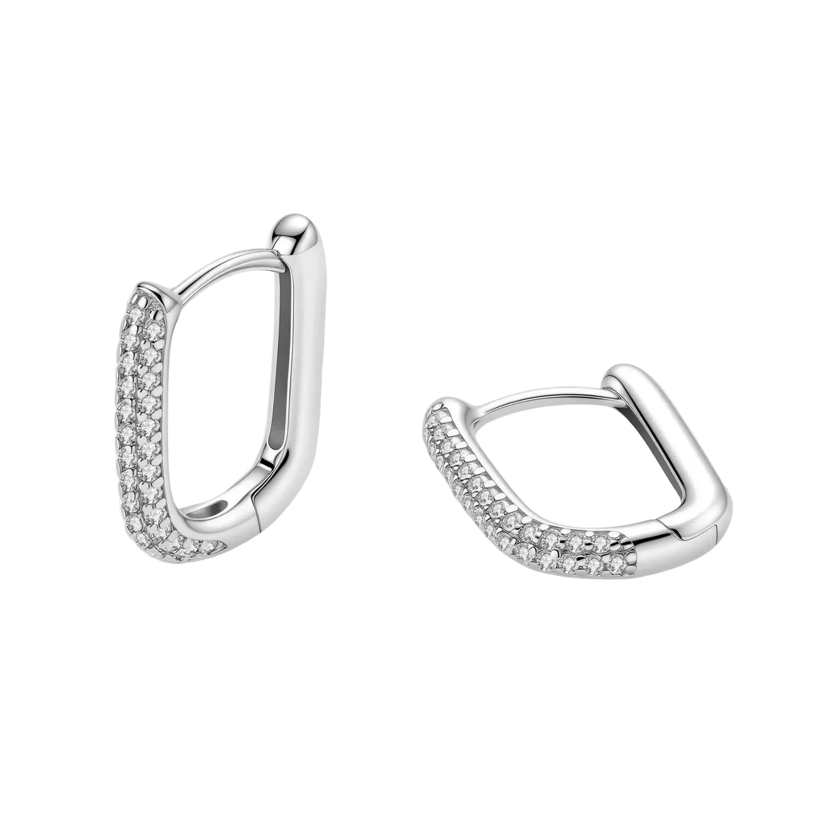 Close-up of platinum-plated sterling silver huggie hoops with pavé crystal setting on white background.