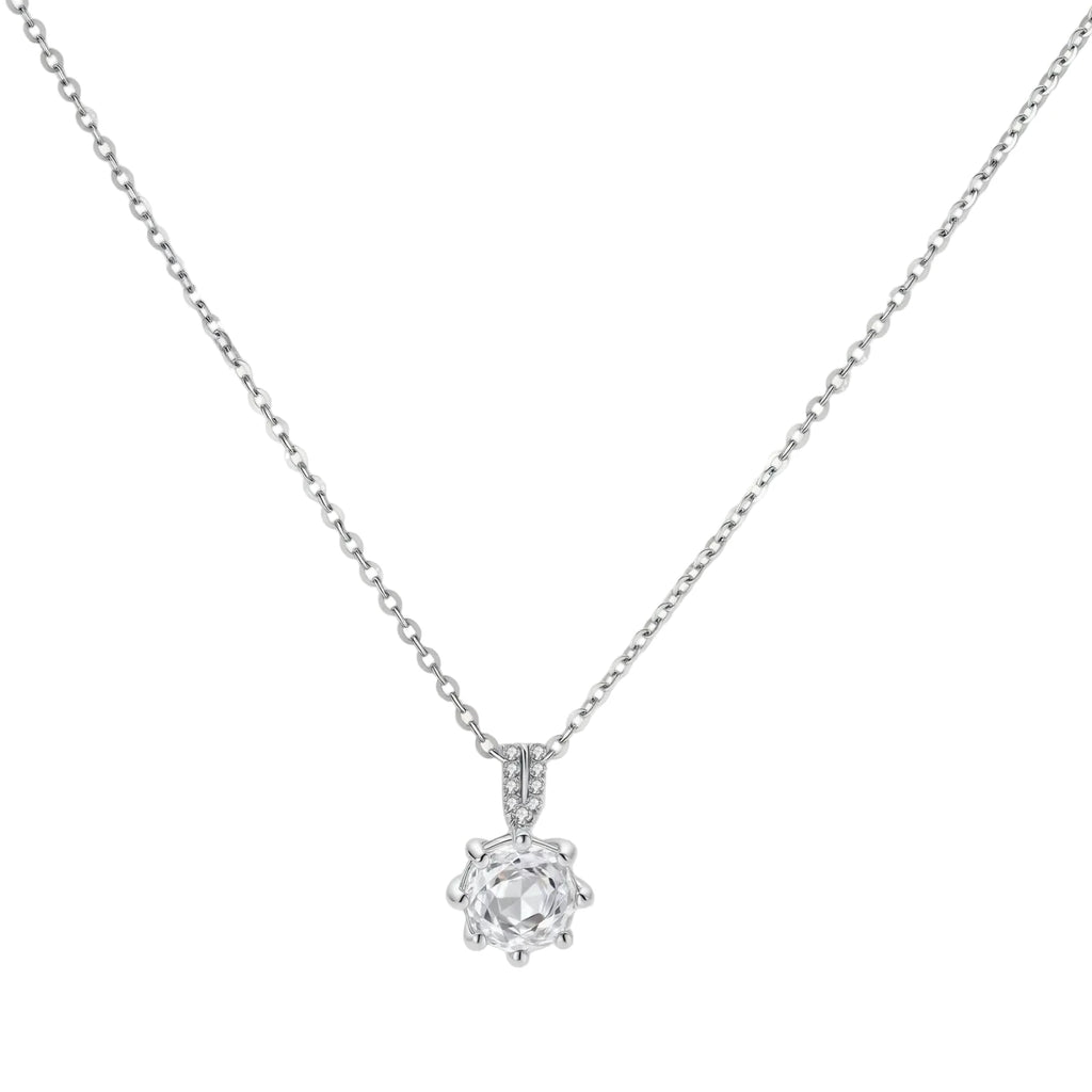 Platinum-plated sterling silver necklace with round clear crystal pendant and decorative bail on neutral background.